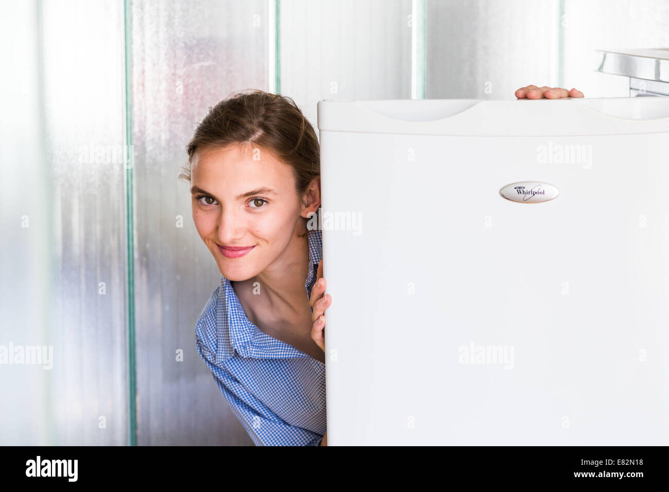 Woman in front of a refrigerator. Stock Photo