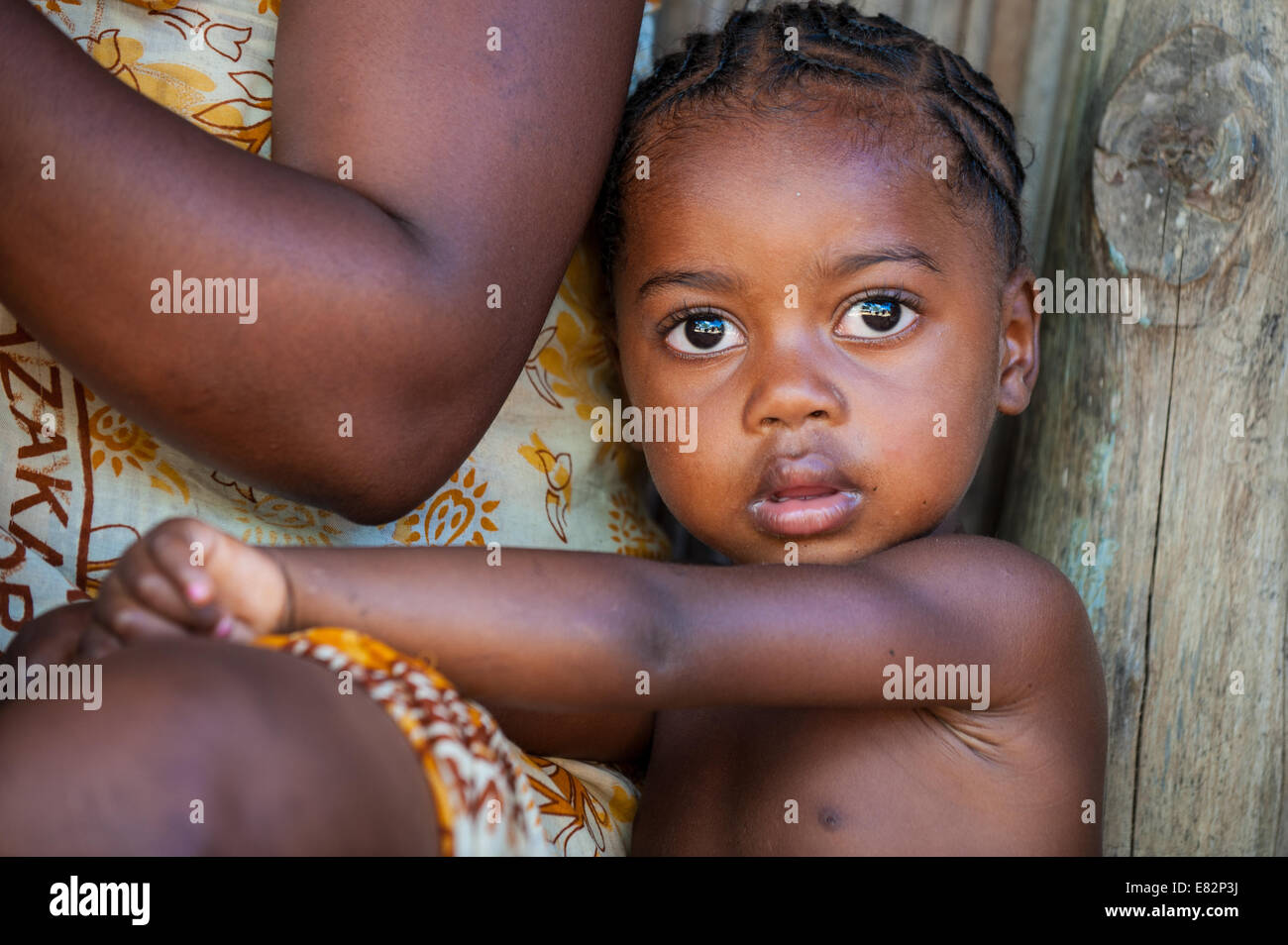 African little girl with beautiful big eyes living in a  rural village, Madagascar Stock Photo