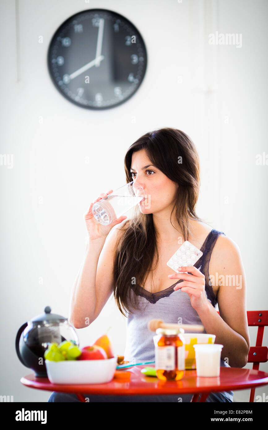 Administration of medications during breakfast. Stock Photo