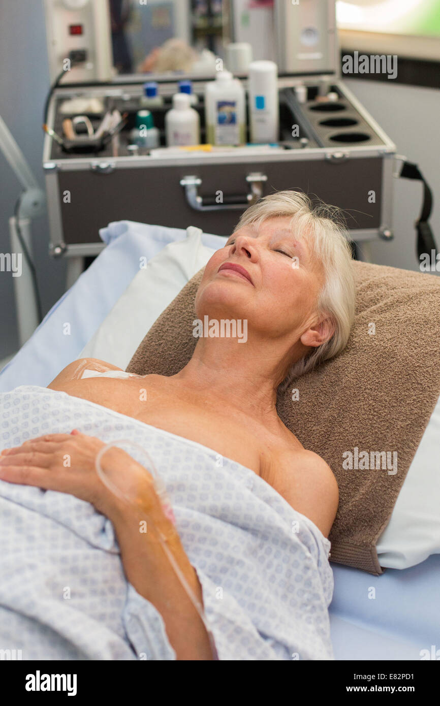 Comfort care and well-being made by an auxiliary nurse trained to 'feel well-being' to improve the overall care of hospitalized Stock Photo
