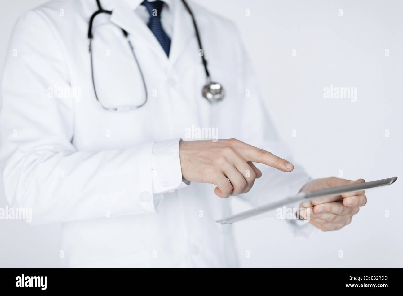 male doctor holding tablet pc Stock Photo - Alamy
