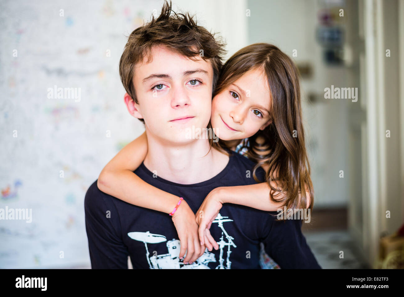 7 year old girl and teenage boy. Stock Photo