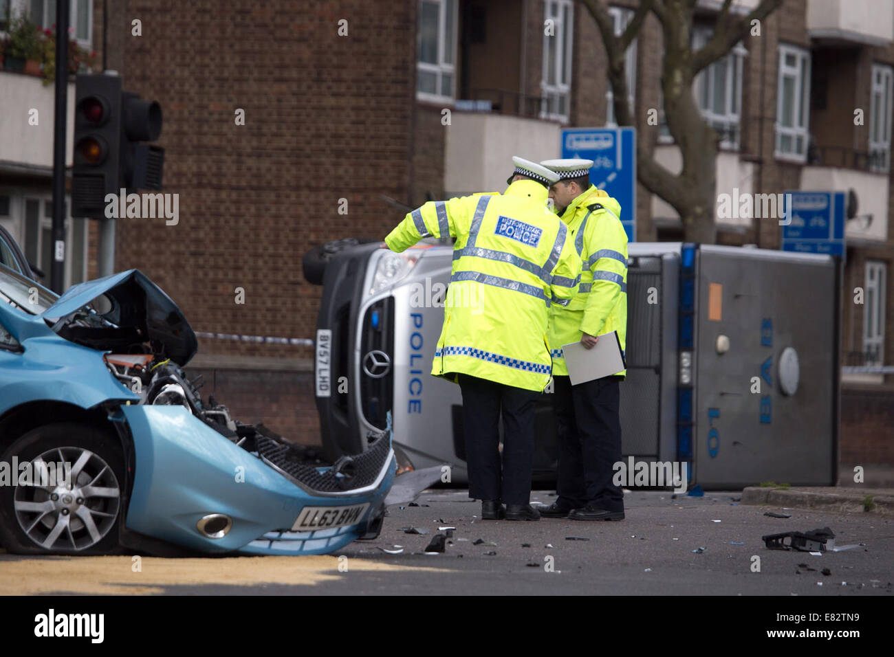 A Police Riot Van Flips Over On Its Side After Crashing Into A ...