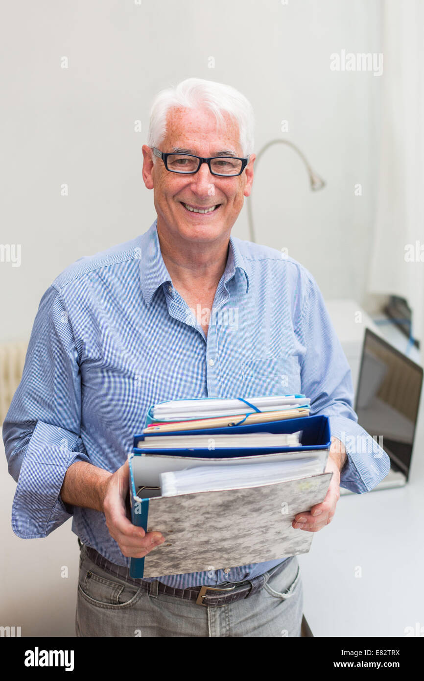 Man with administrative papers. Stock Photo