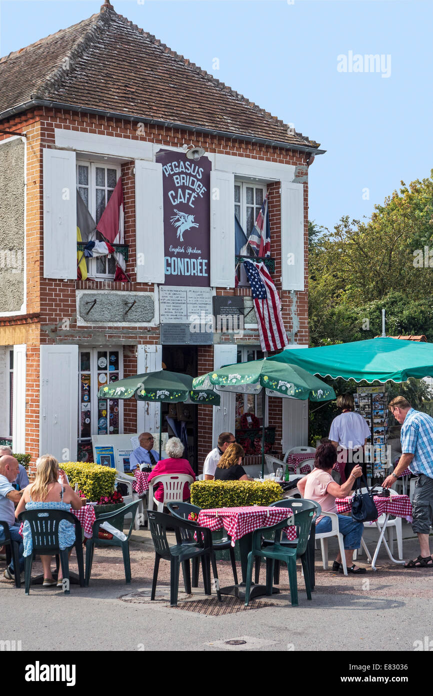 Tourists at Pégasus Bridge café, first French house to be liberated during D-Day in WW2 at Bénouville, Lower Normandy, France Stock Photo