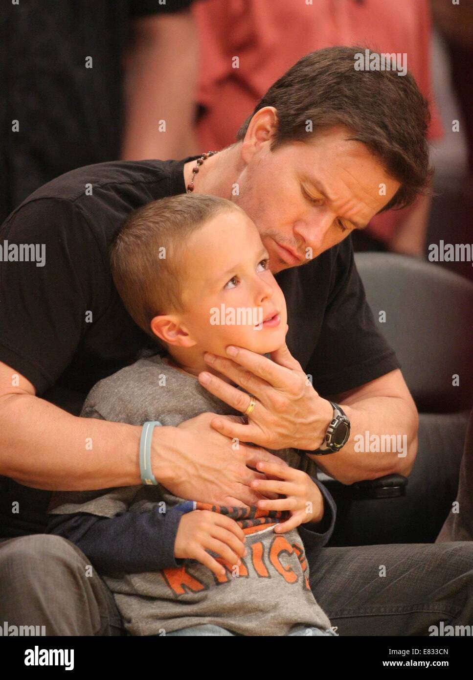 Celebrities at the Lakers game. The Los Angeles Lakers defeated the New York Knicks by the final score of 127-96 at Staples Center  Featuring: Mark Wahlberg,Brendan Joseph Wahlberg,Michael Robert Wahlberg Where: Los Angeles, California, United States When: 25 Mar 2014 Stock Photo
