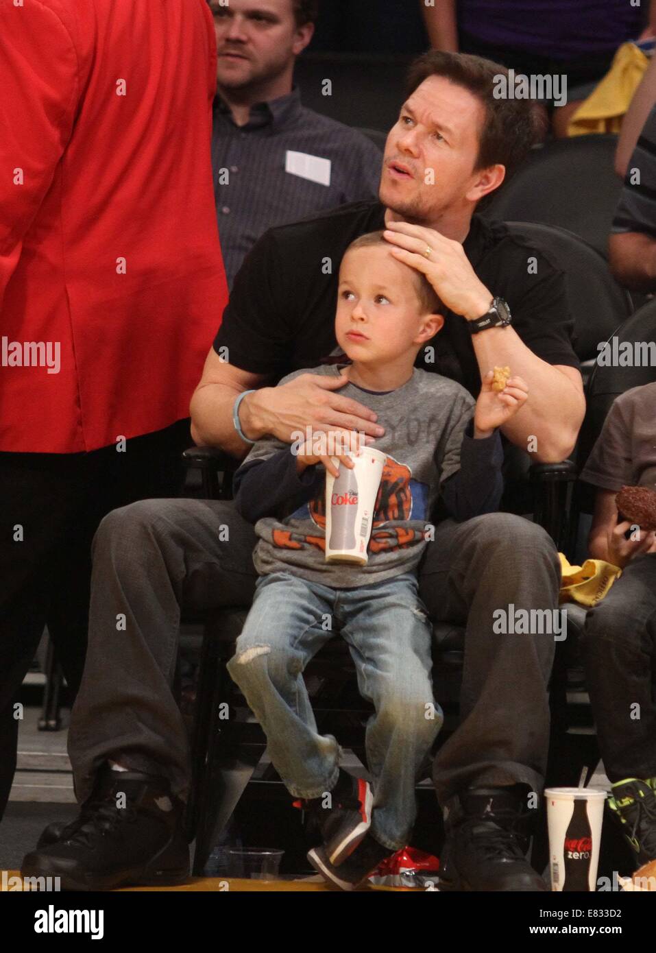 Celebrities at the Lakers game. The Los Angeles Lakers defeated the New York Knicks by the final score of 127-96 at Staples Center  Featuring: Mark Wahlberg,Brendan Joseph Wahlberg,Michael Robert Wahlberg Where: Los Angeles, California, United States When: 25 Mar 2014 Stock Photo