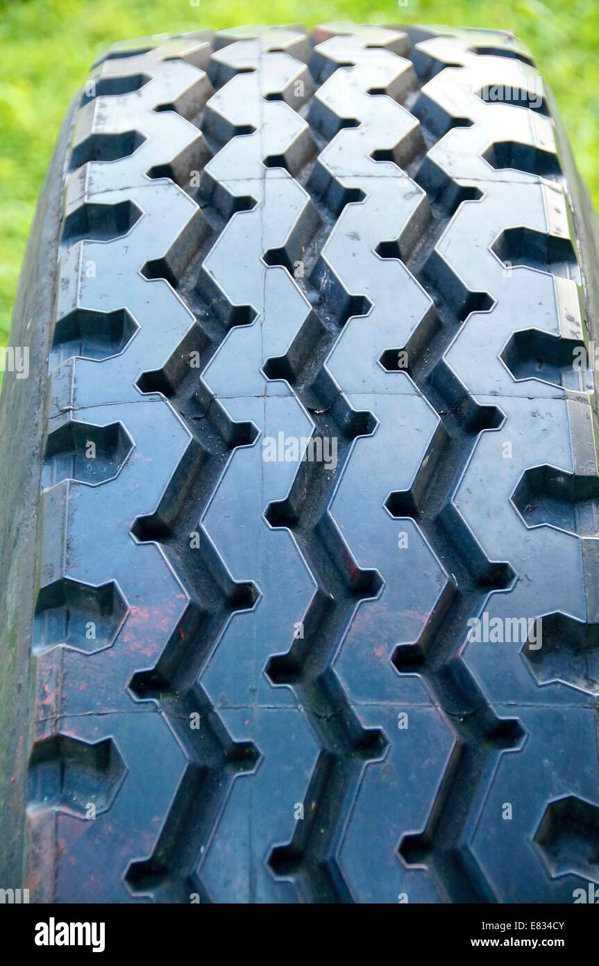 Close view of tire on the grass Stock Photo