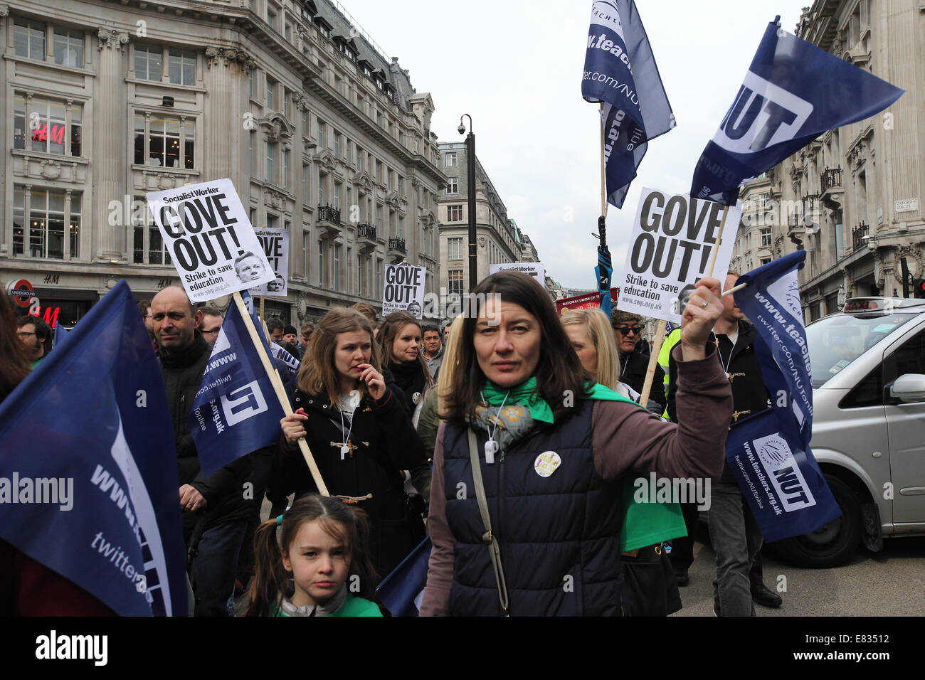 Teachers march in Central London during a national day of strike action. They are protesting against education reforms and working conditions brought about by Michael Gove's policies. They angry at unfair pensions changes and excessive workload/bureaucracy and demand better pay.  Featuring: Demonstrators,Protesters Where: London, United Kingdom When: 26 Mar 2014 Stock Photo