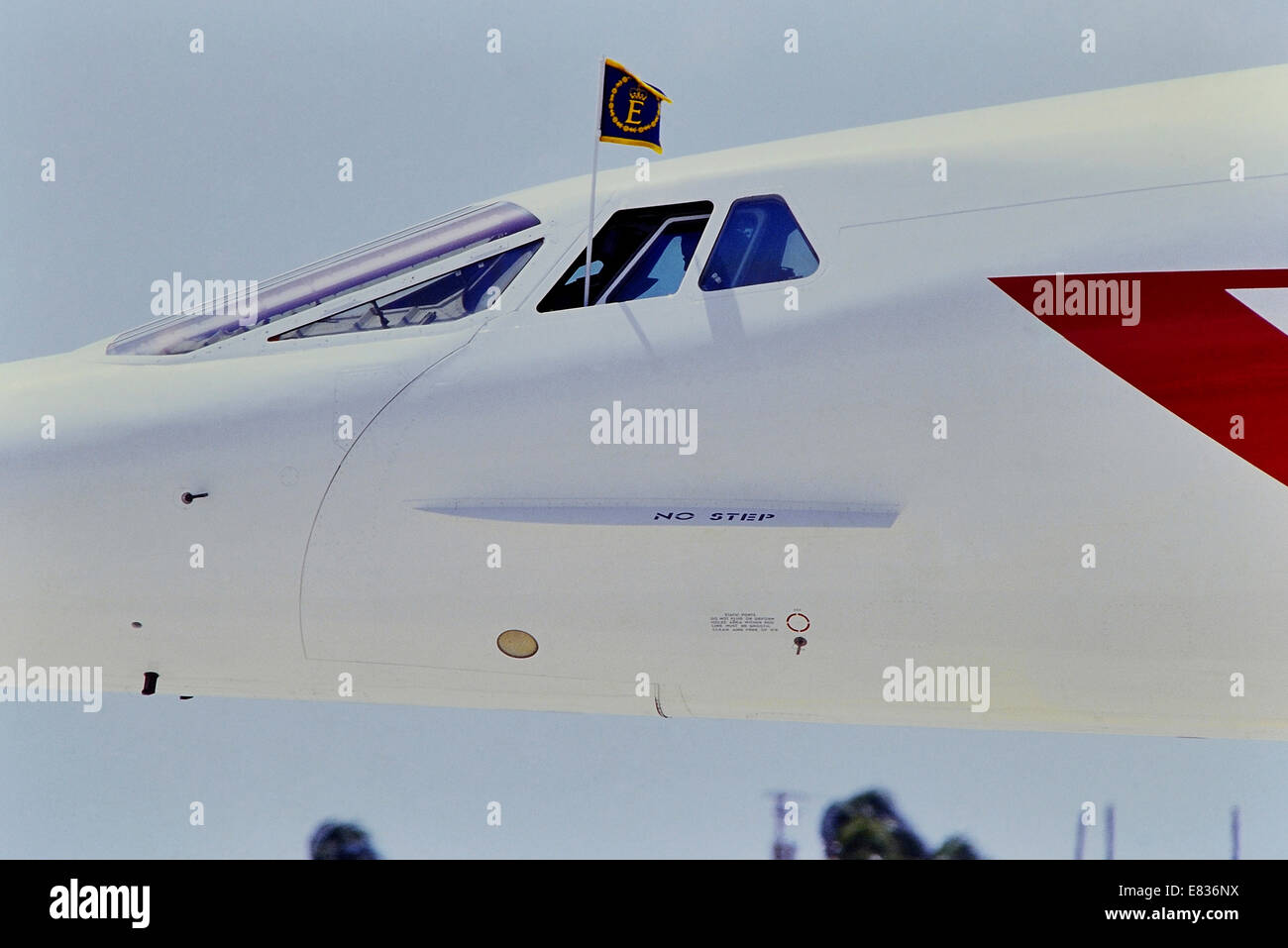 Concorde flying Queen Elizabeth II personal flag at Barbados. Caribbean, 1989 royal visit Stock Photo