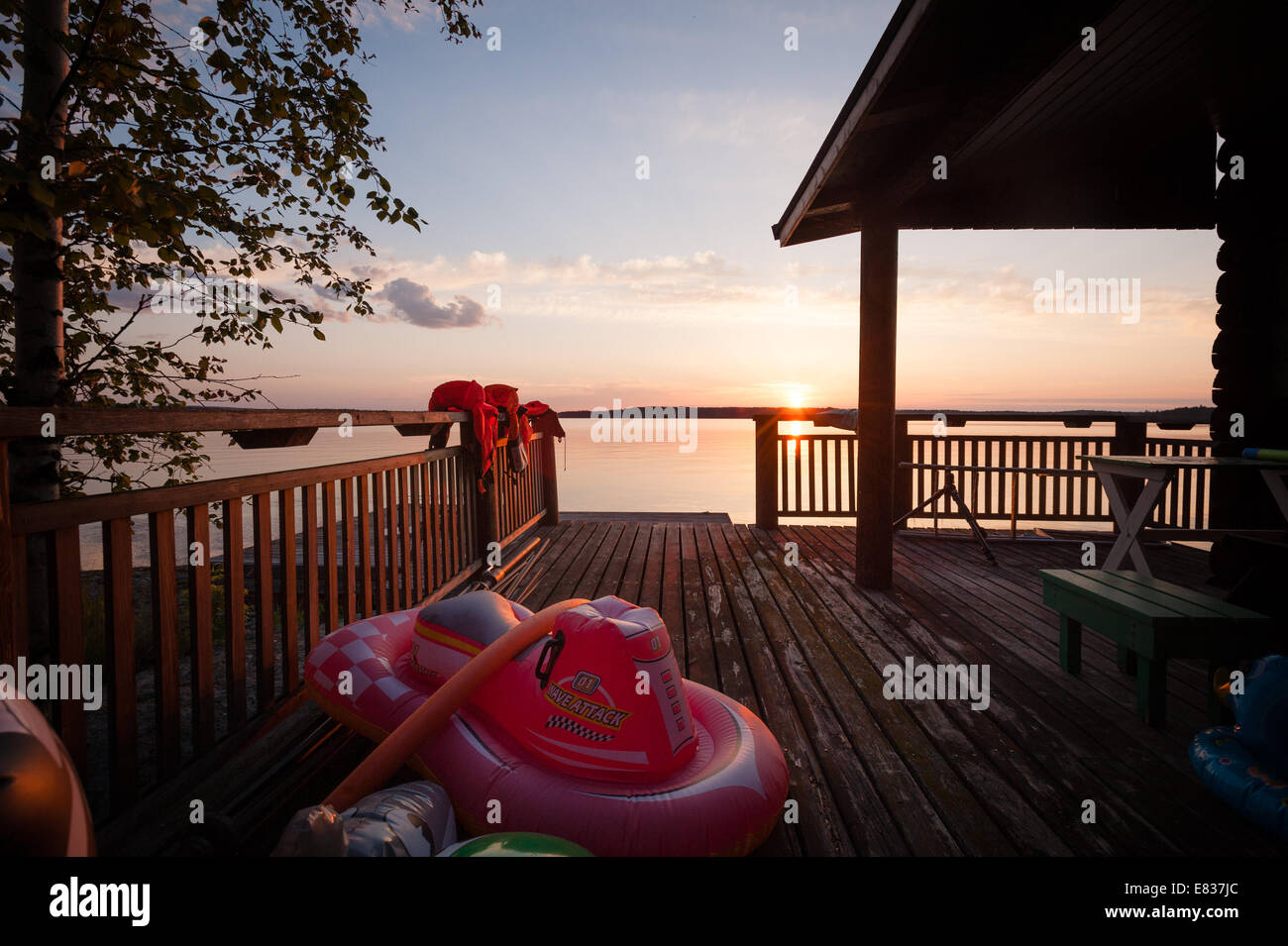 Pier with inflatable toys on midsummer night's eve Stock Photo