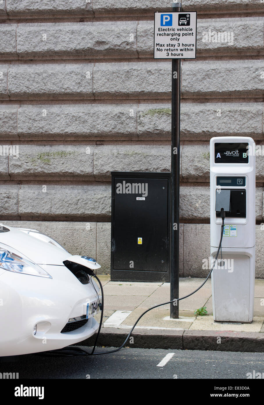 Roadside charging point for electric car hires stock photography and