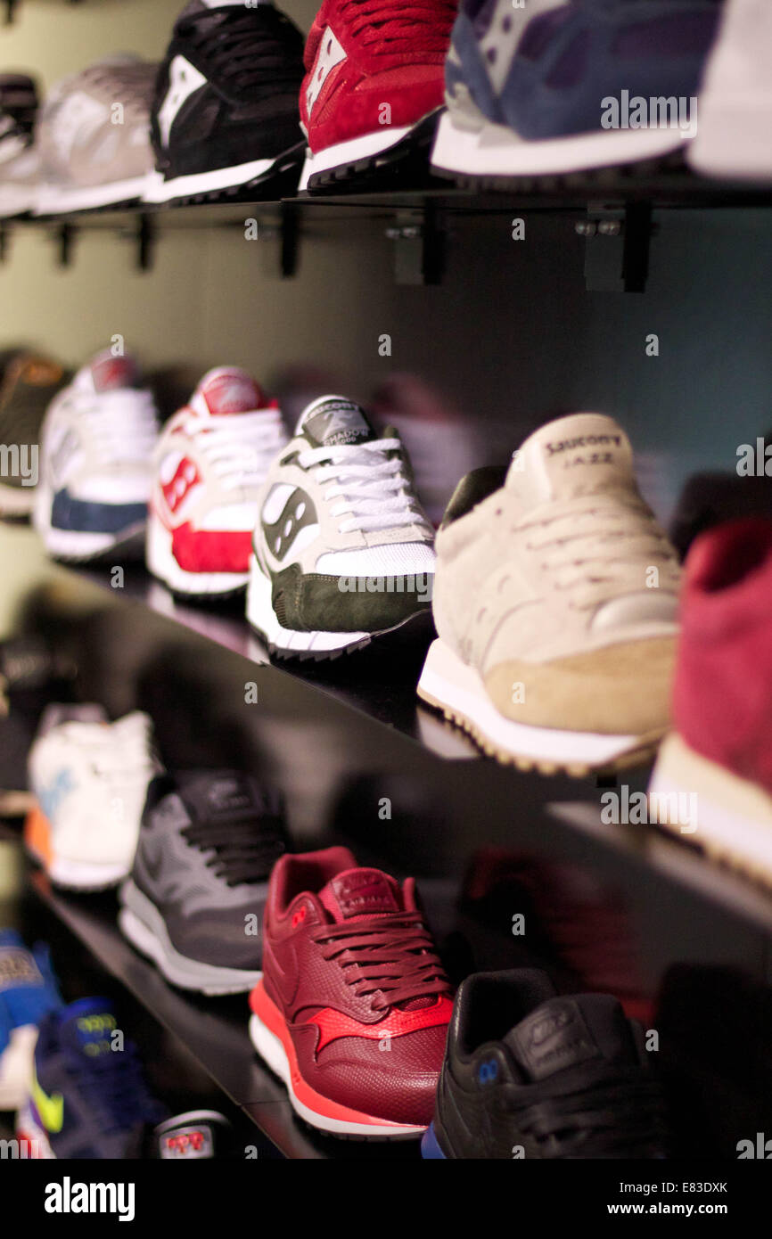 Trainers on display in a shop. Stock Photo
