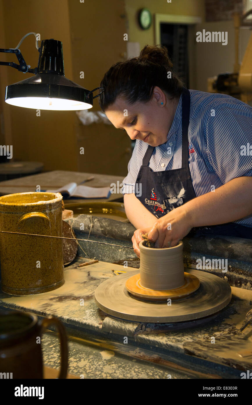 Dearborn, Michigan An artisan in the pottery shop at Greenfield