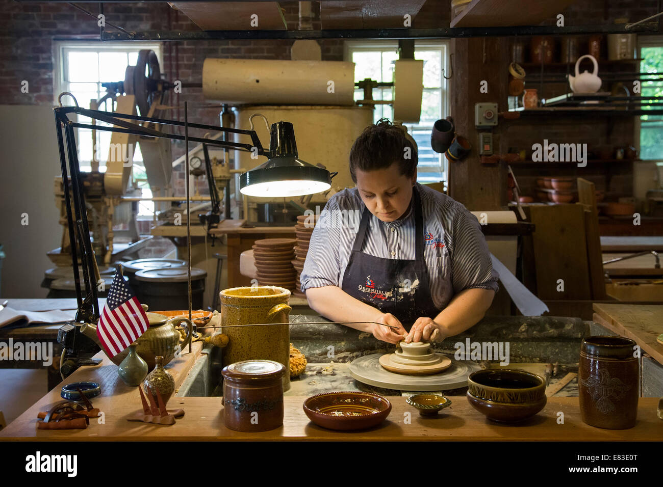 Dearborn, Michigan An artisan in the pottery shop at Greenfield