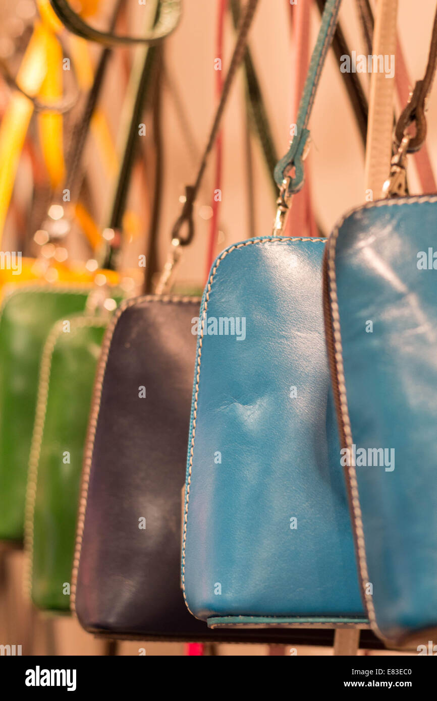 Handbags hanging in a shop Stock Photo Alamy