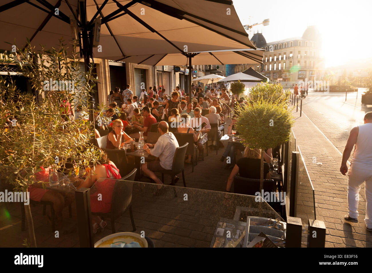 Customers eating evening meal at street restaurant in Bergerac. Stock Photo