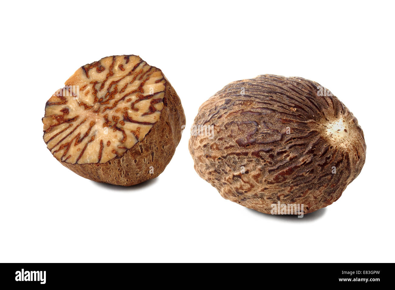Nutmegs on white Stock Photo Alamy