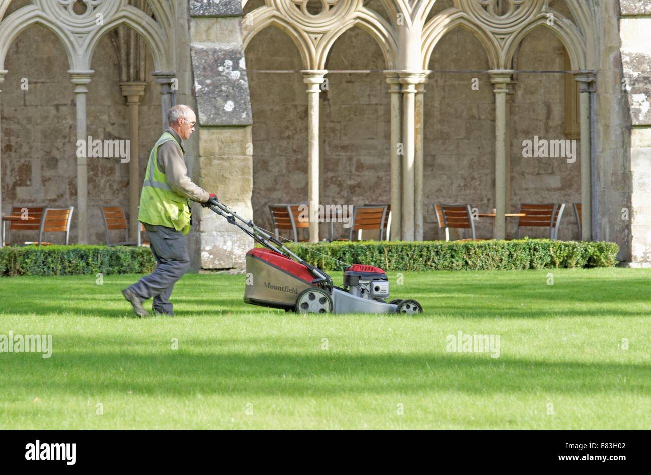 Grass cutting in cloisters in Salisbury Cathedral Stock Photo