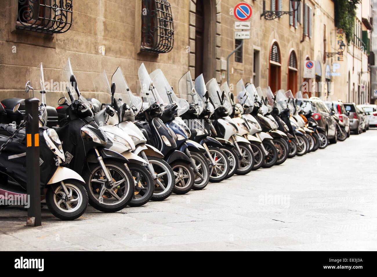 This typical street in Florence, Italy. Scooters being the most popular