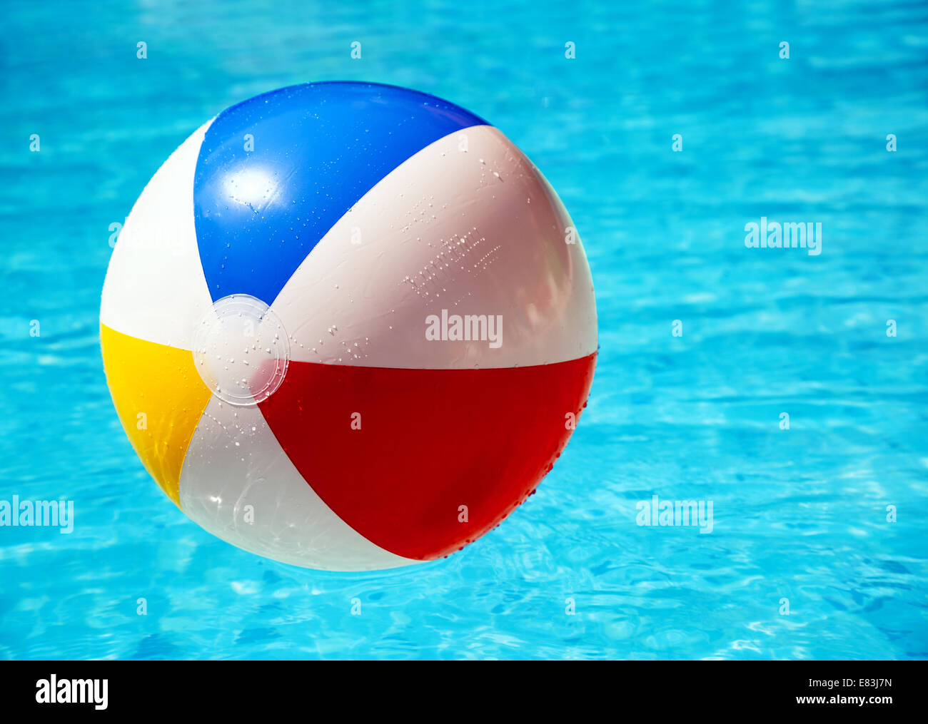 Beach ball in swimming pool Stock Photo