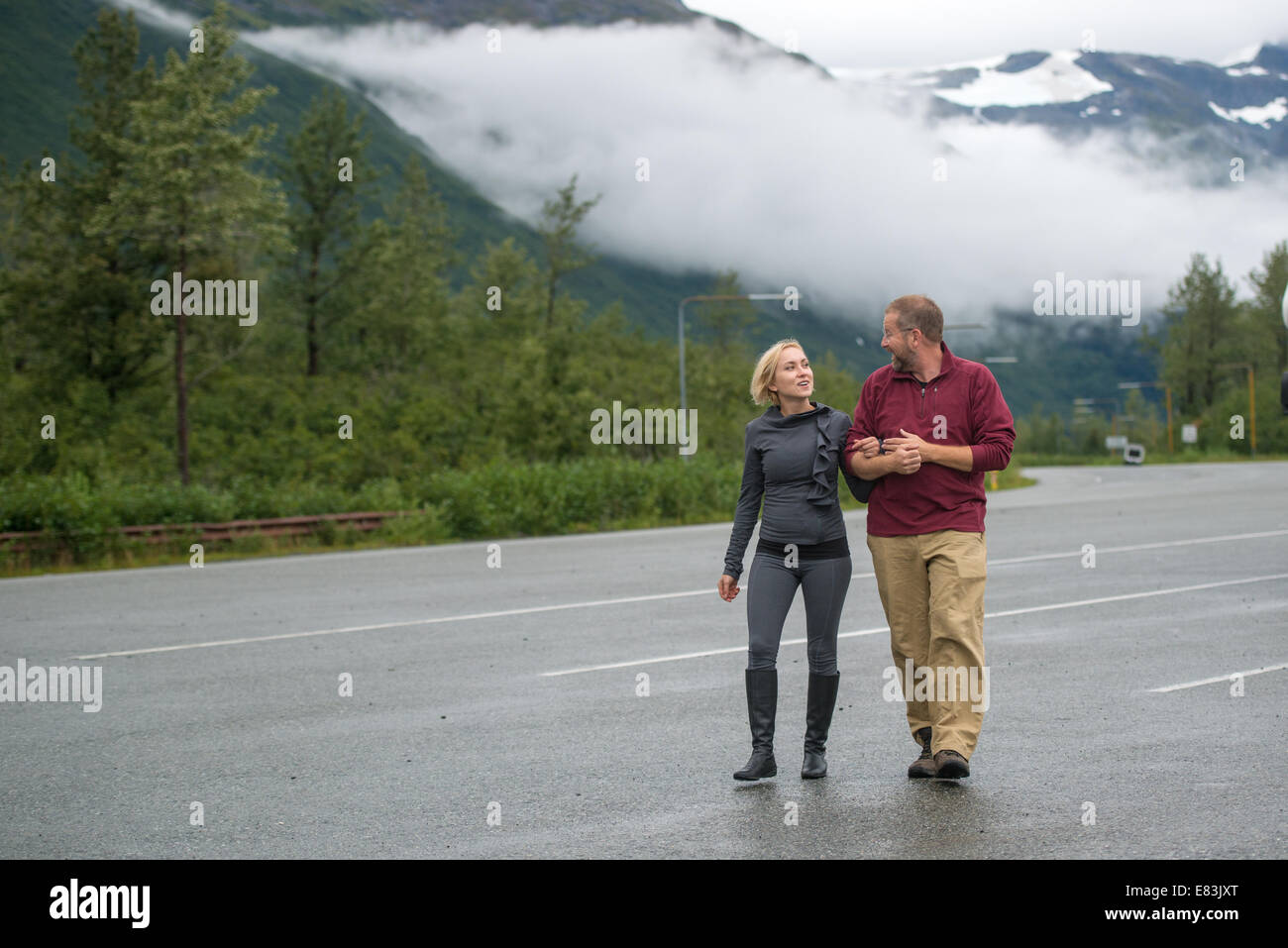 Man and woman walking outdoors in Alaska Stock Photo