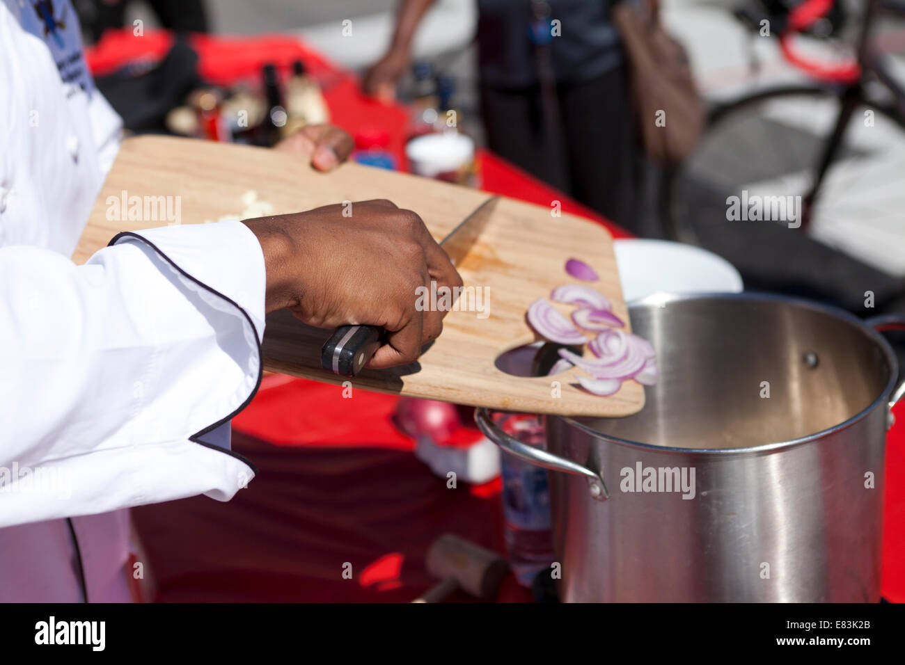 Cooking demonstration by African-American cook at cultural fair - USA Stock Photo