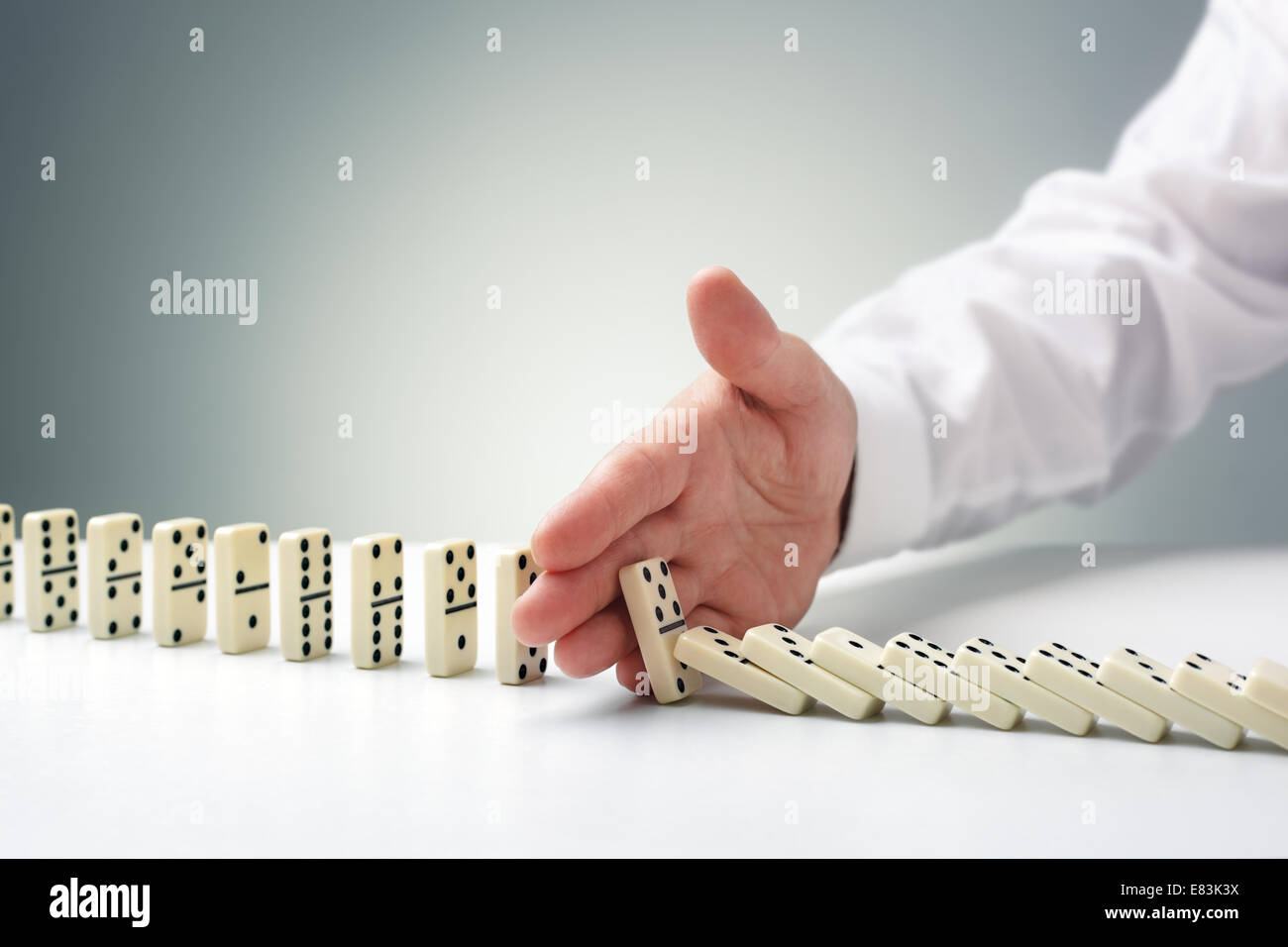 Stopping the domino effect Stock Photo