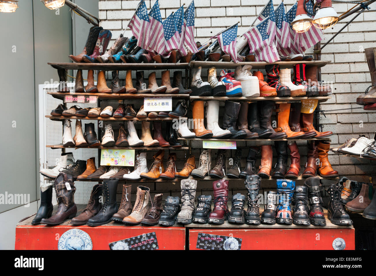 Leather boots for sale on street side market stall, Tokyo, Japan Stock Photo