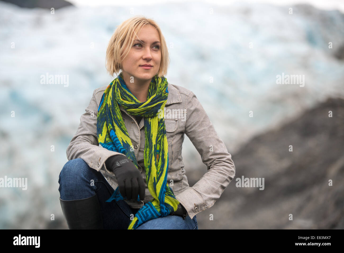 Blonde woman in front of Exit glacier near Seward  Alaska Stock Photo