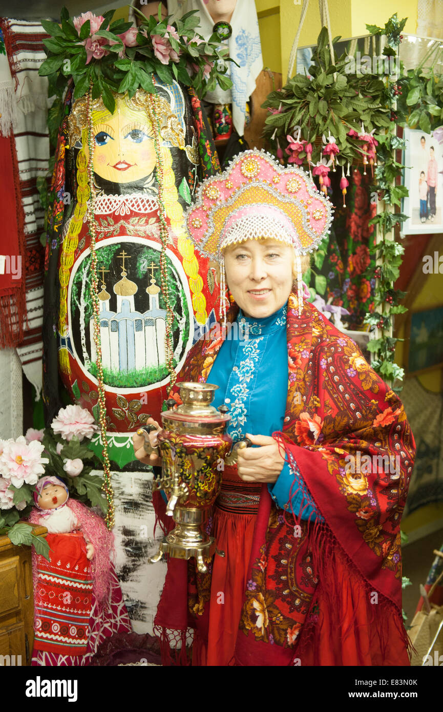 Russian Alaska - Nikolaevsk AK People wearing traditional Russian costume in gift shop. Stock Photo