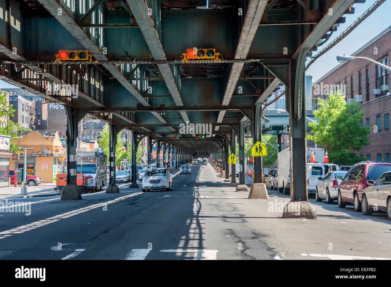 Cars drive under the elevated train line on 10th avenue New York City Stock Photo Alamy