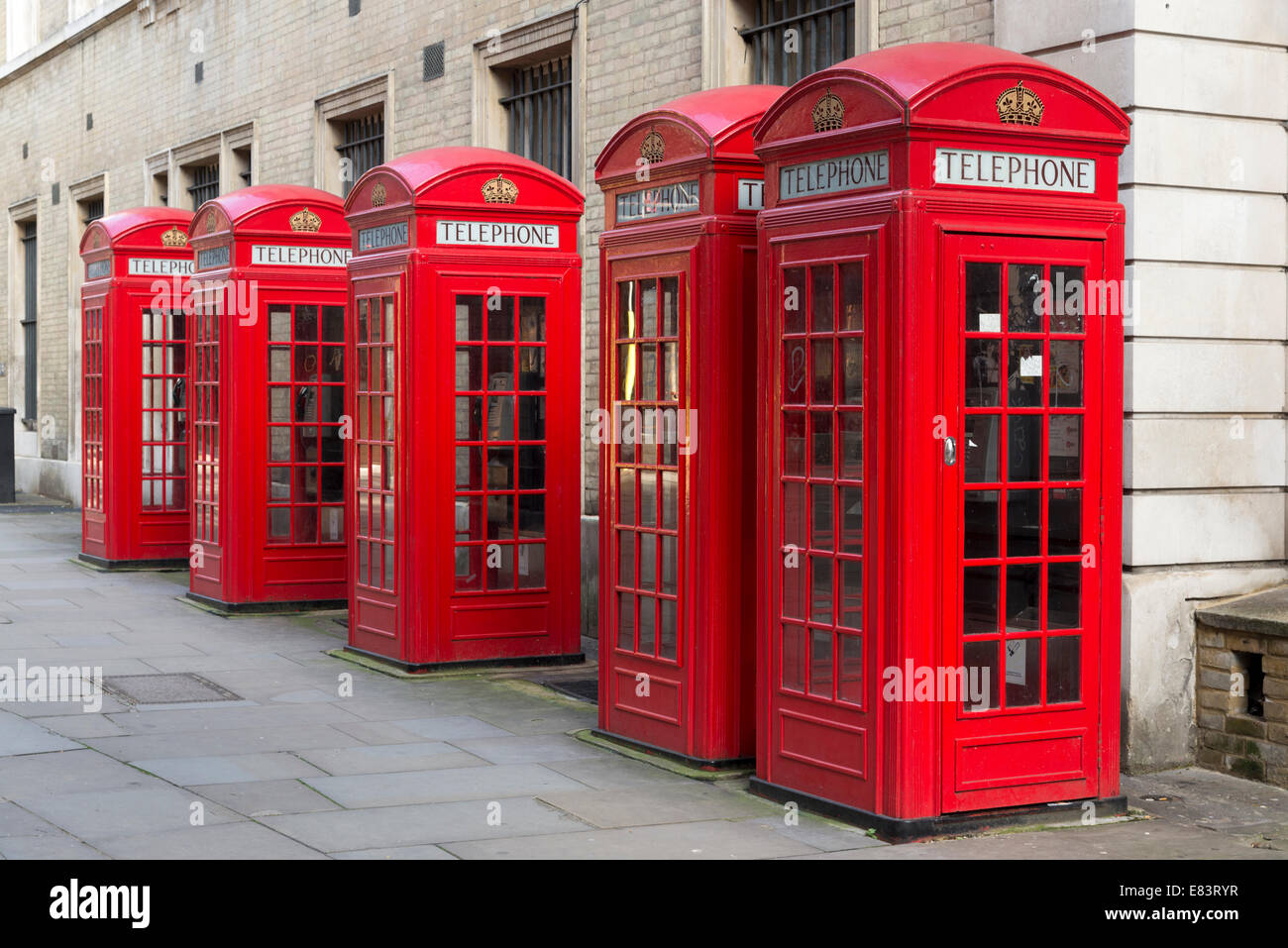 Row of red telephone boxes, London, England, UK Stock Photo