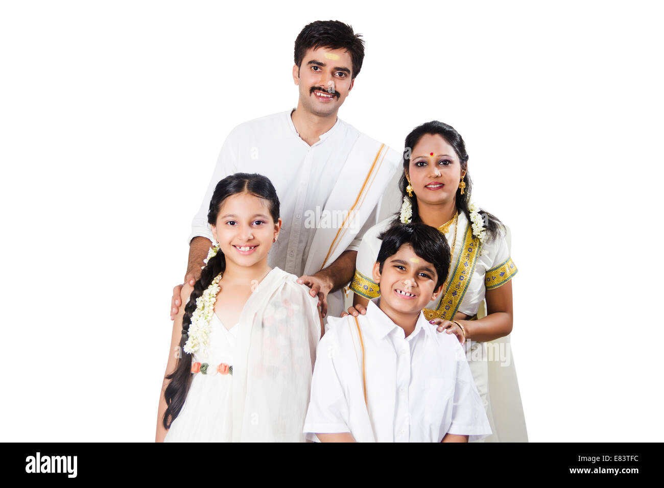 Premium Photo | Indian Family Posing For A Portrait In A Studio