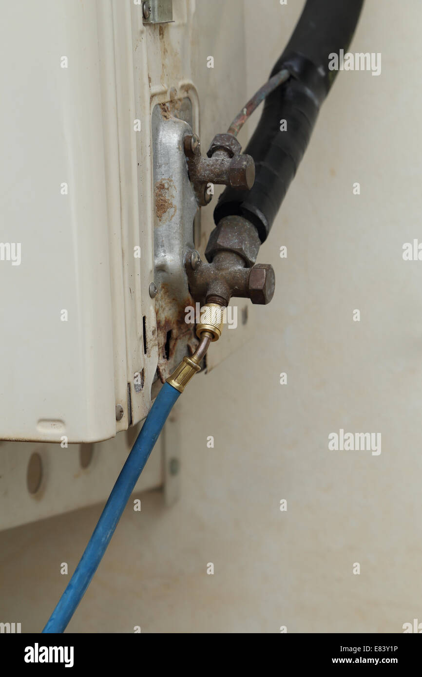 filling refrigerant to air conditioner drip valve Stock Photo Alamy