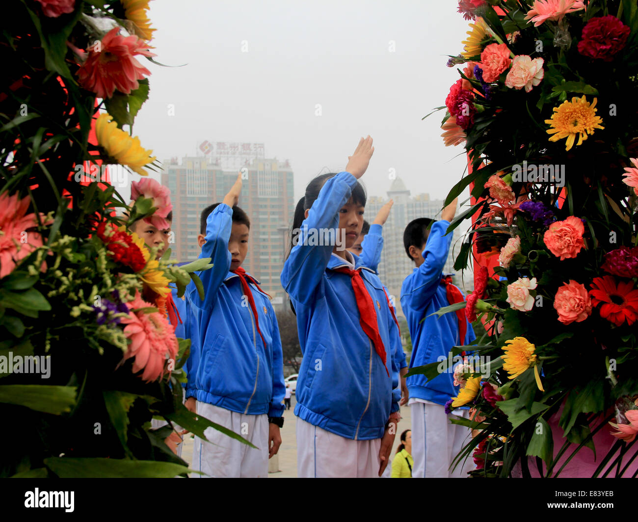Nanchang. 30th Sep, 2014. Young students salute at a memorial ceremony in Pingxiang, east China's Jiangxi Province, Sept. 30, 2014, on the occasion of the first Martyrs' Day. Credit:  Zheng Ming/Xinhua/Alamy Live News Stock Photo