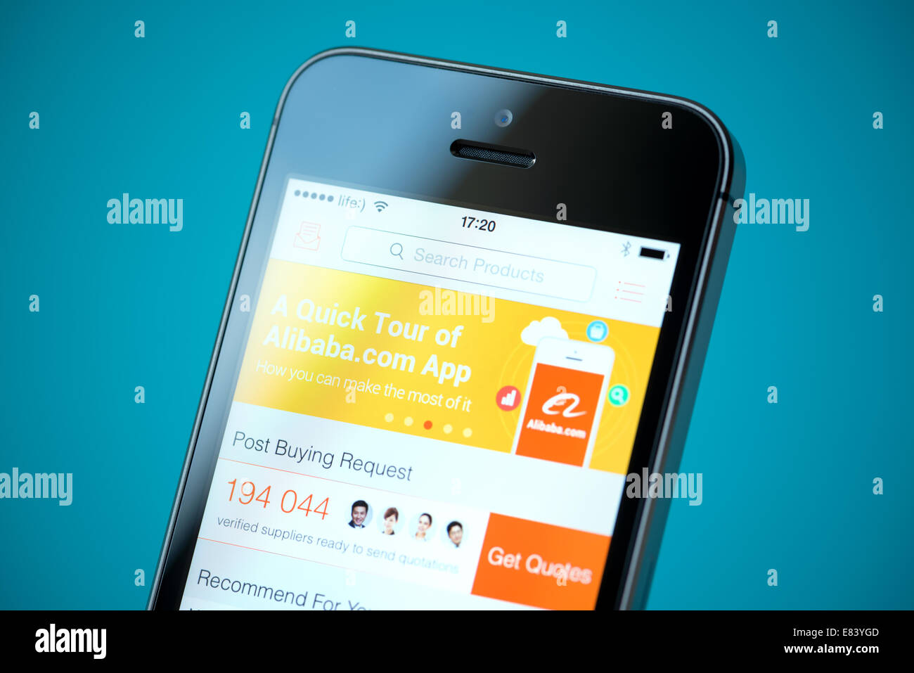 Close-up shot of brand new Apple iPhone 5S with Alibaba online store application on a screen. Stock Photo