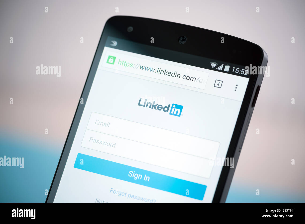 Close-up shot of brand new Google Nexus 5, powered by Android 4.4 version, with LinkedIn sign in website form on a screen. Stock Photo