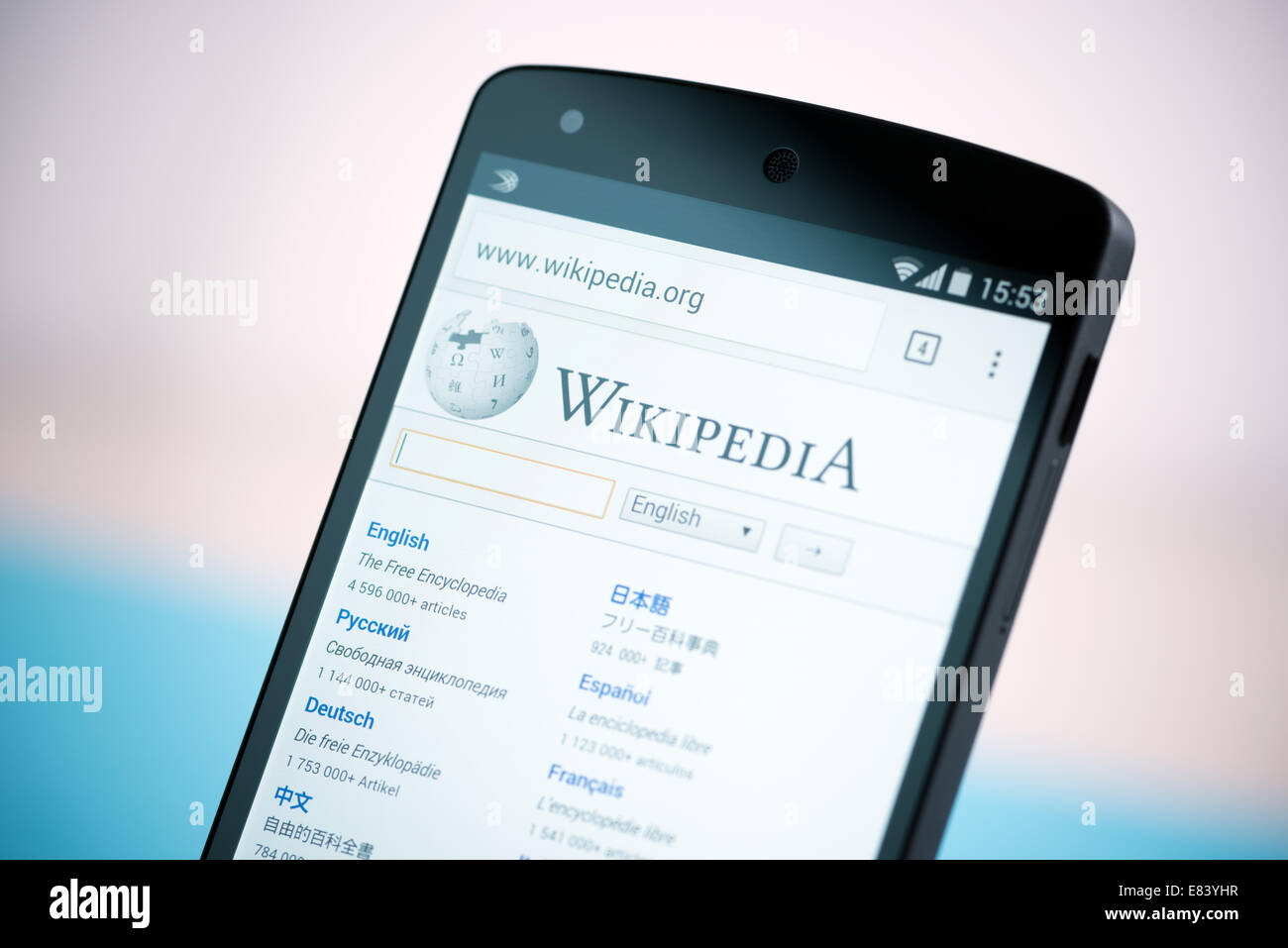 Close-up shot of brand new Google Nexus 5, powered by Android 4.4 version, with Wikipedia website homepage on a screen. Stock Photo