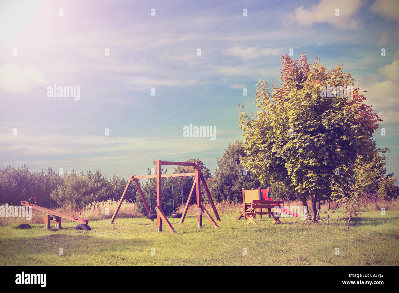 Retro vintage style picture of playground in park. Stock Photo