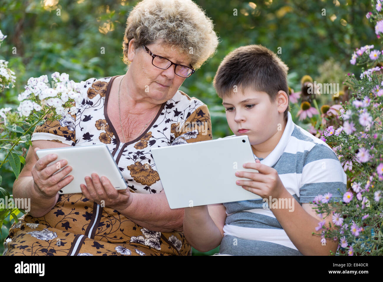 grandma grandson watching tablet pc stock photos grandma grandson