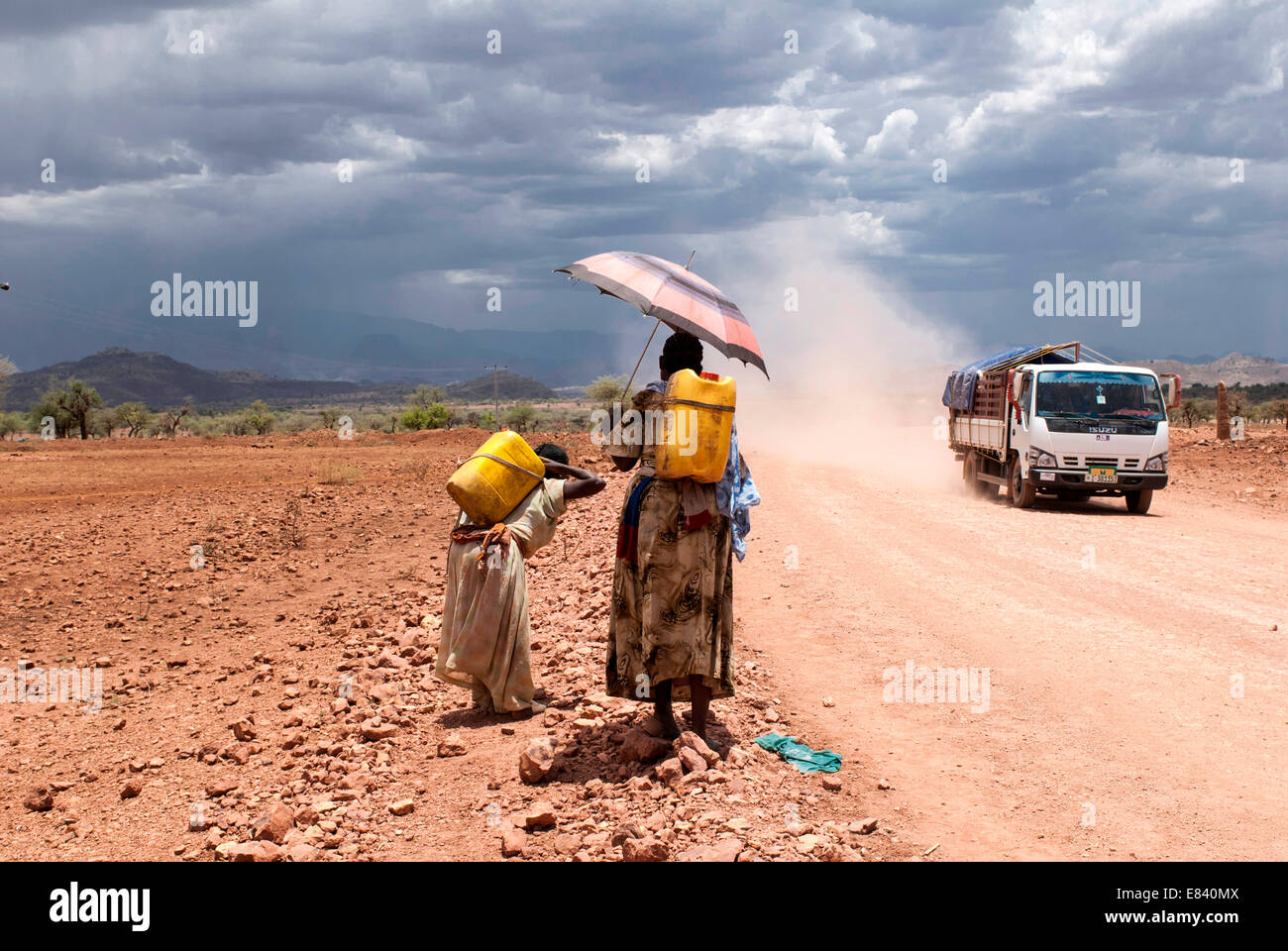 Female water carriers on the road between Adrigat and Mekele, Ethiopia Stock Photo