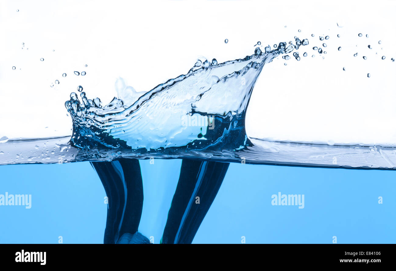 Fresh clean water splash in blue. Stock Photo