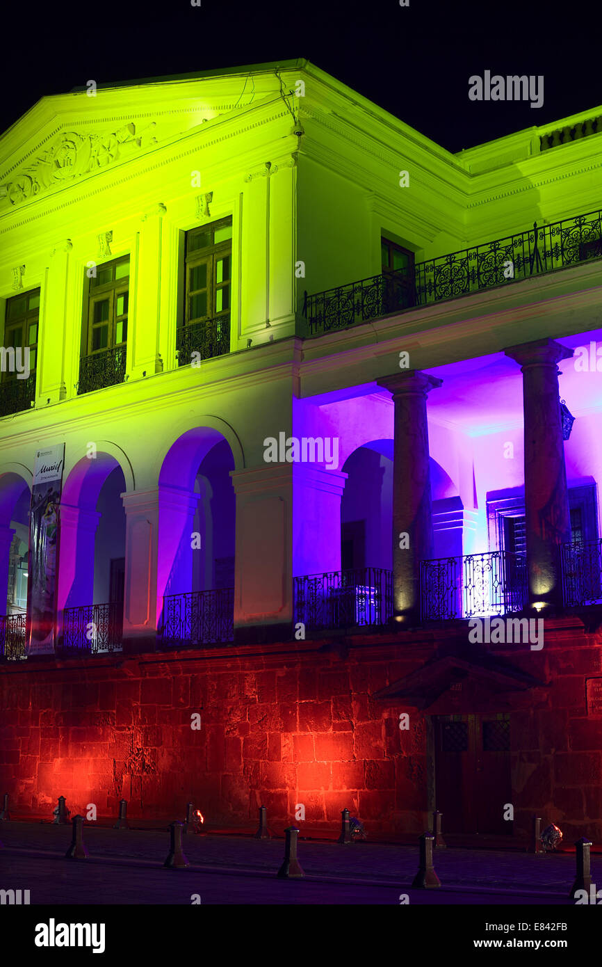 The Carondelet Palace (Presidential Palace) on Plaza Grande illuminated with the Ecuadorian colors in Quito, Ecuador Stock Photo