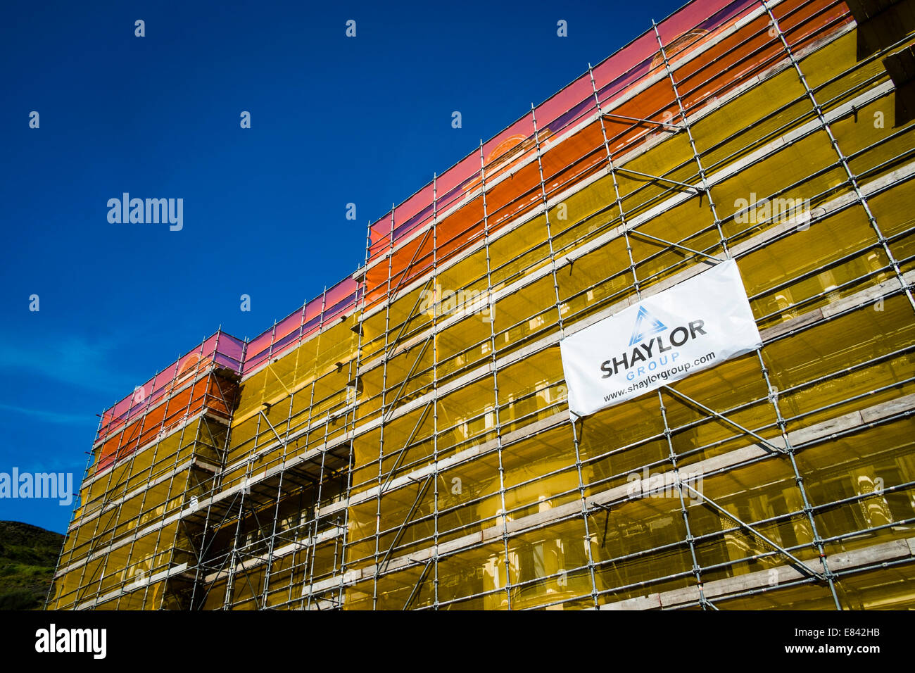 Scaffolding on property and logo banner for Shaylor group construction building refurbishment contractors  company firm UK Stock Photo