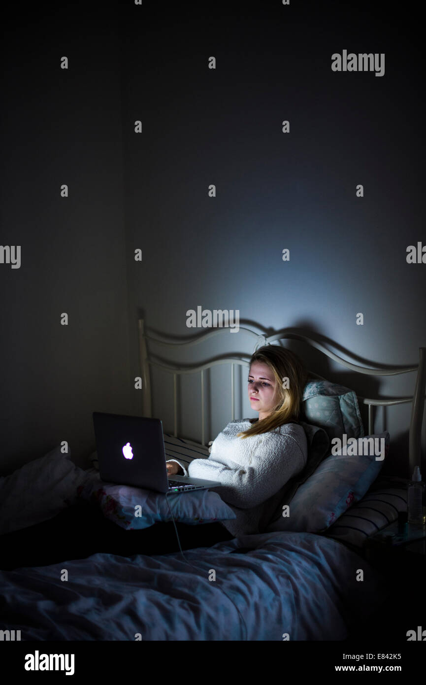 A 15 Year Old Teenage Girl Alone In Her Bedroom In The Dark