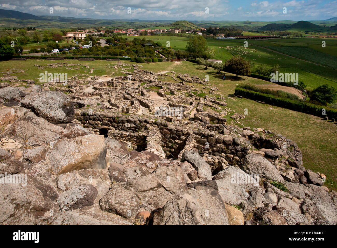 General view of the Prehistoric World Heritage Site of Su Nuraxi at Barumini, together with its surrounding village. Sardinia, I Stock Photo