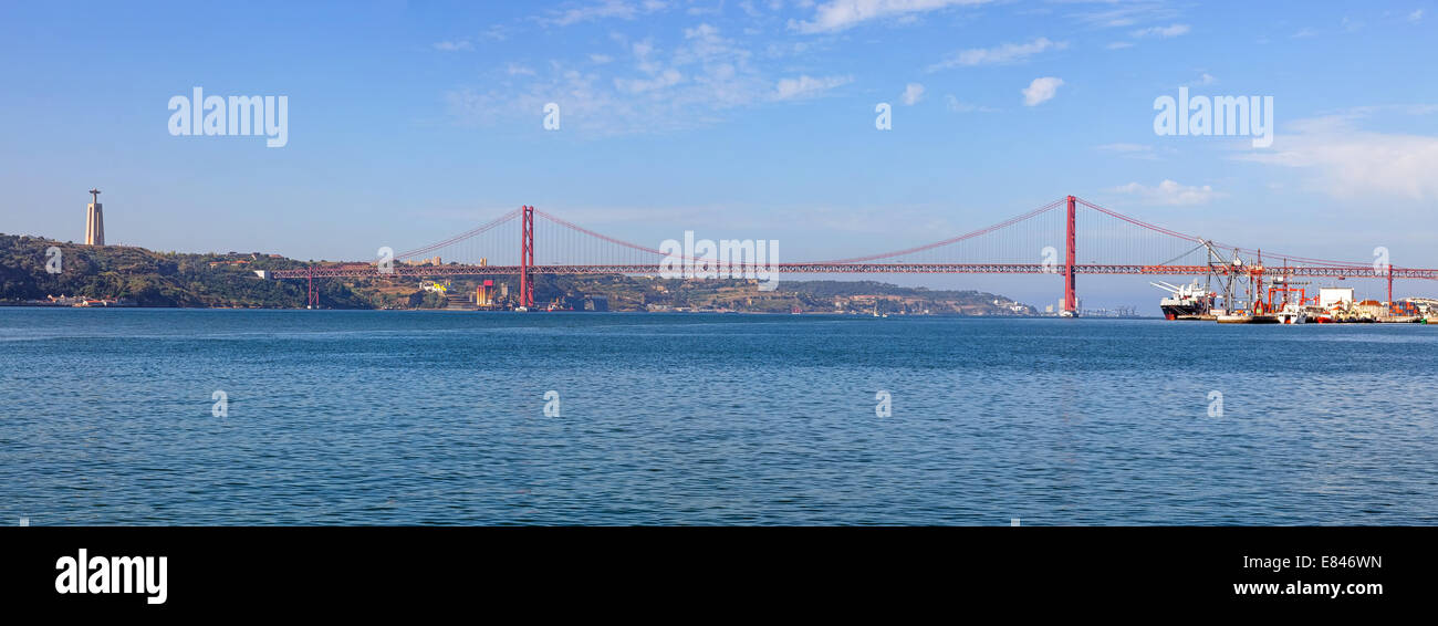 25 de Abril Bridge. One of the largest suspension bridges in the world. Connects Lisbon to Almada over the Tagus River. Portugal Stock Photo