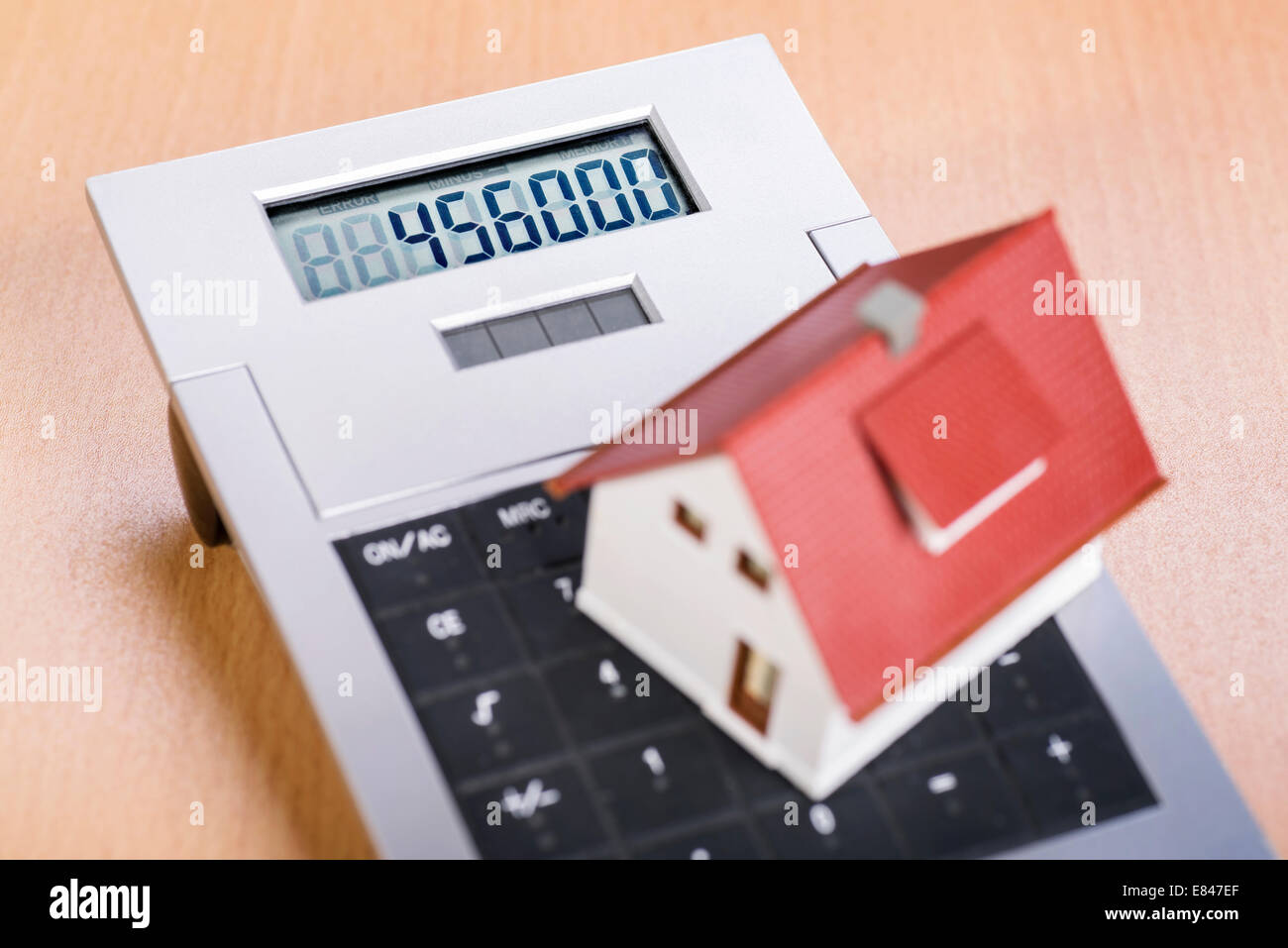 House stands on the keyboard of a calculator Stock Photo Alamy