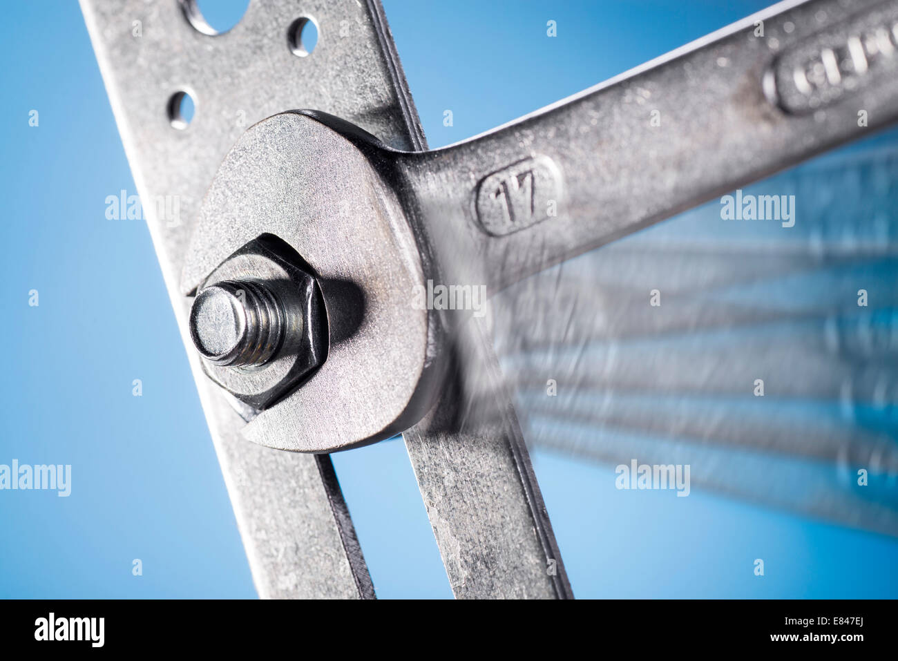 Close-up of a wrench, tighten the nut. Stock Photo